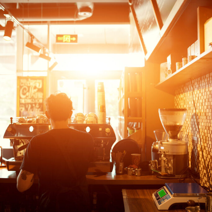 Barista at work in a coffee shop. Preparation service concept