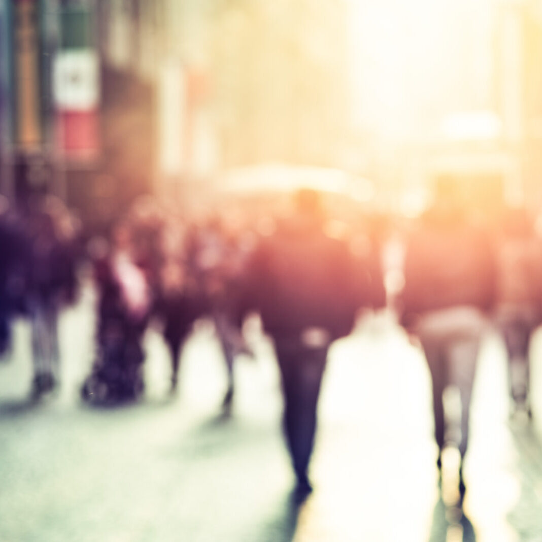 people walking in the street, blurry